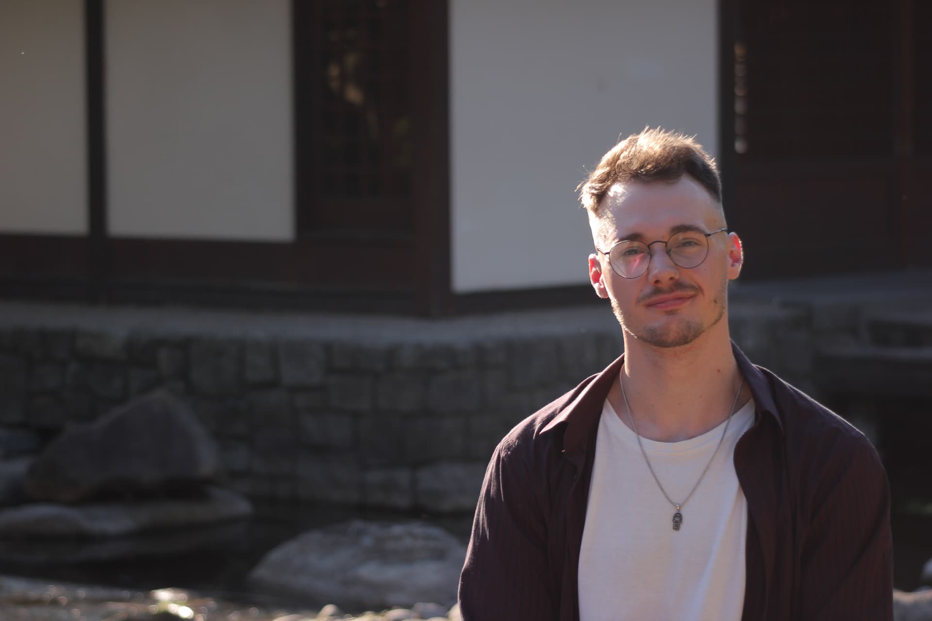 Portrait of the mentor outdoors in front of a traditional building